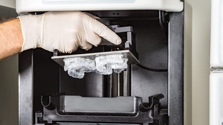 Un-clench night guard being fabricated on a dental 3D printer in a UK lab